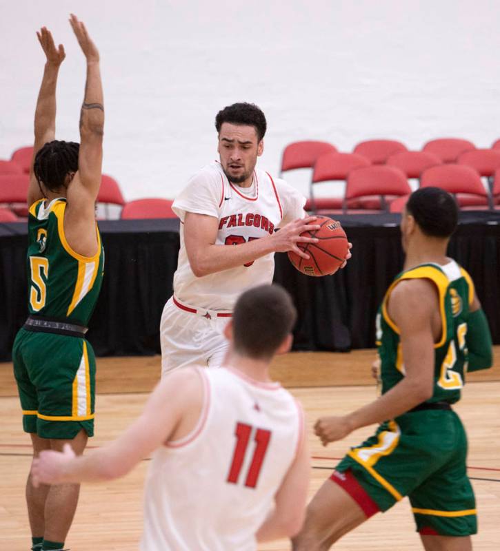 University of Wisconsin-River Falls' forward Julian Jackson (25) works to get around New Jersey ...