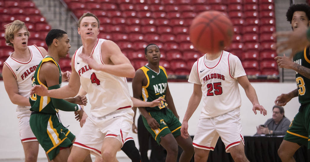 University of Wisconsin-River Falls' forward Alex Ohde (4) watches as his pass is about to be i ...