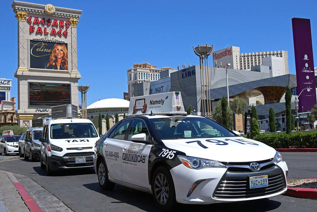 Cab drivers pull into the taxi pick up lane at Caesars Palace in Las Vegas in 2017. (Las Vegas ...