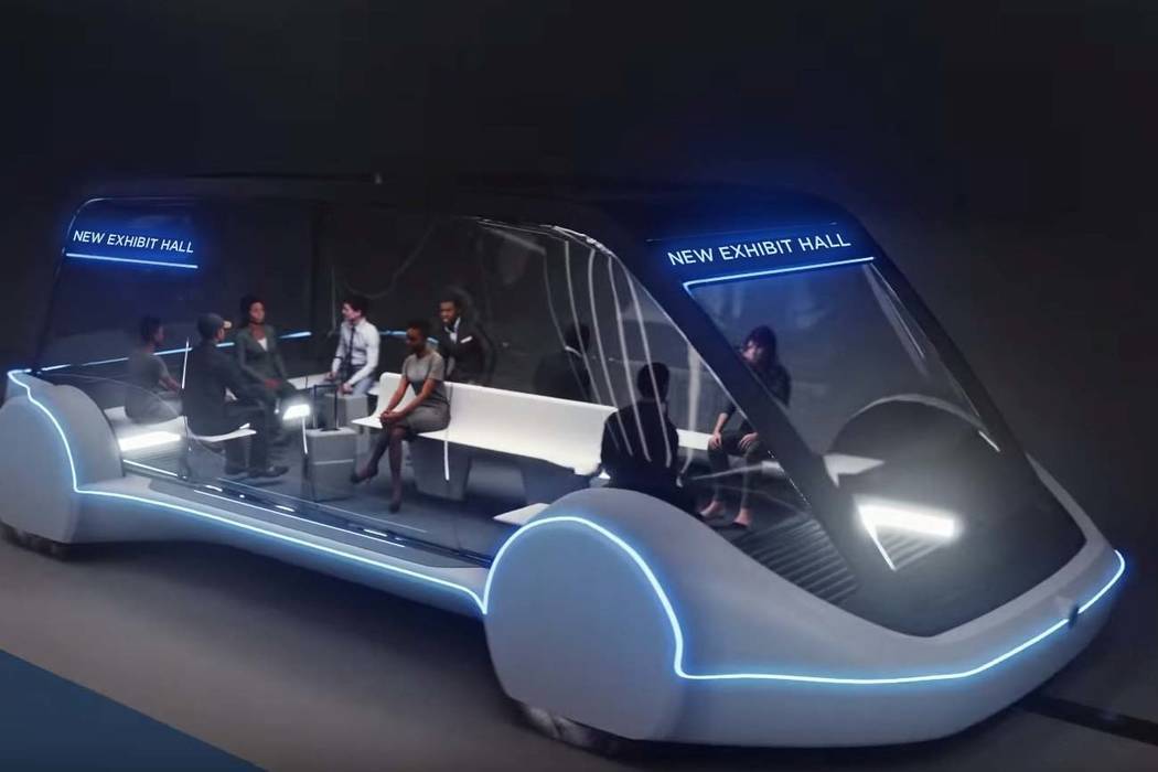 High-occupancy autonomous electric vehicles would run underground between exhibit halls at the ...