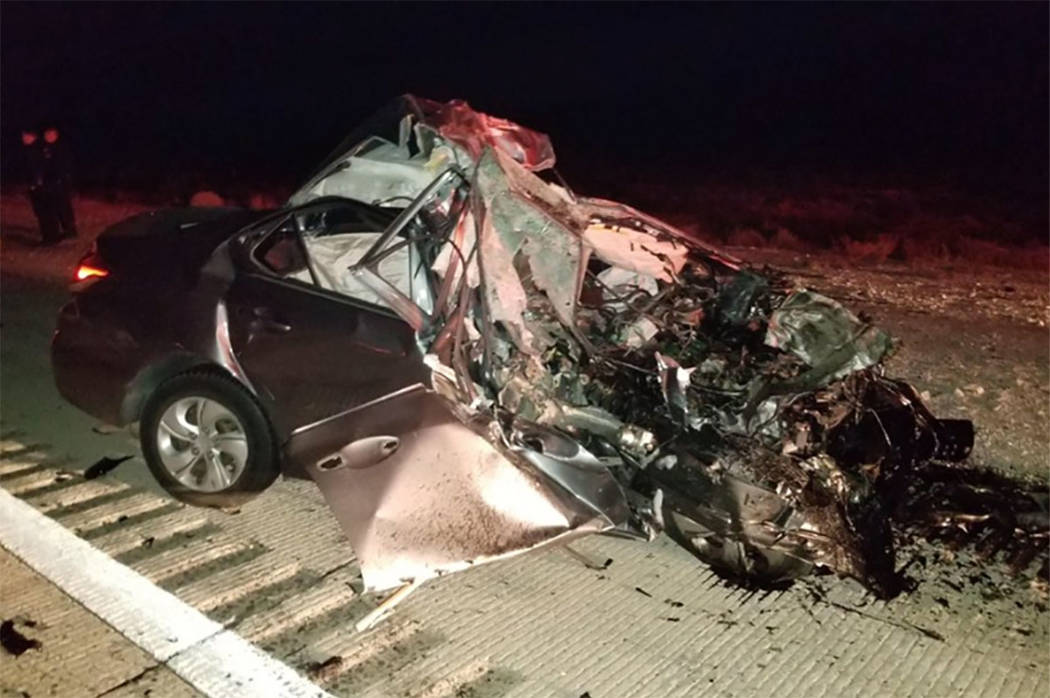 A vehicle is seen at the site of a fatal crash in the northbound lanes of I-15 near Jean, south ...