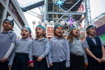 First graders from Desert Torah Academy Day School's choir sing for the crowd at a menorah ligh ...