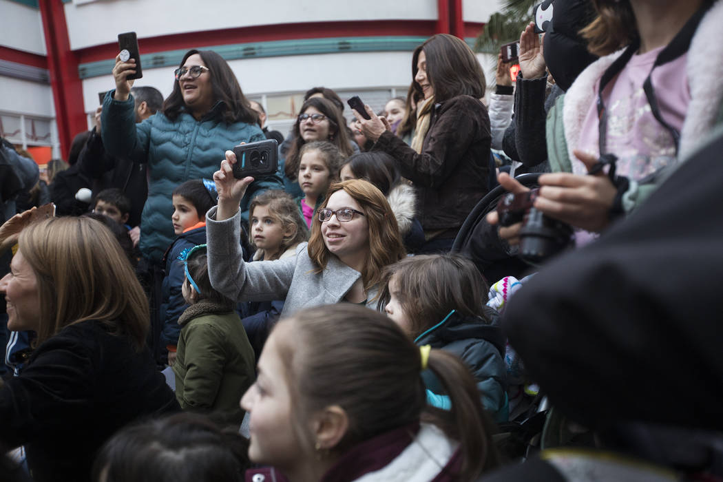 The crowd watches the entertainment at a menorah lighting hosted by Chabad of Southern Nevada f ...