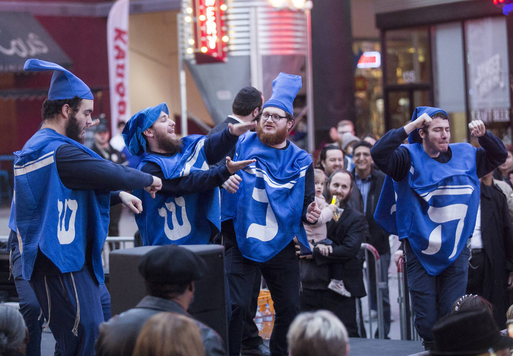 The Dancing Dreidels perform at a menorah lighting hosted by the Chabad of Southern Nevada for ...