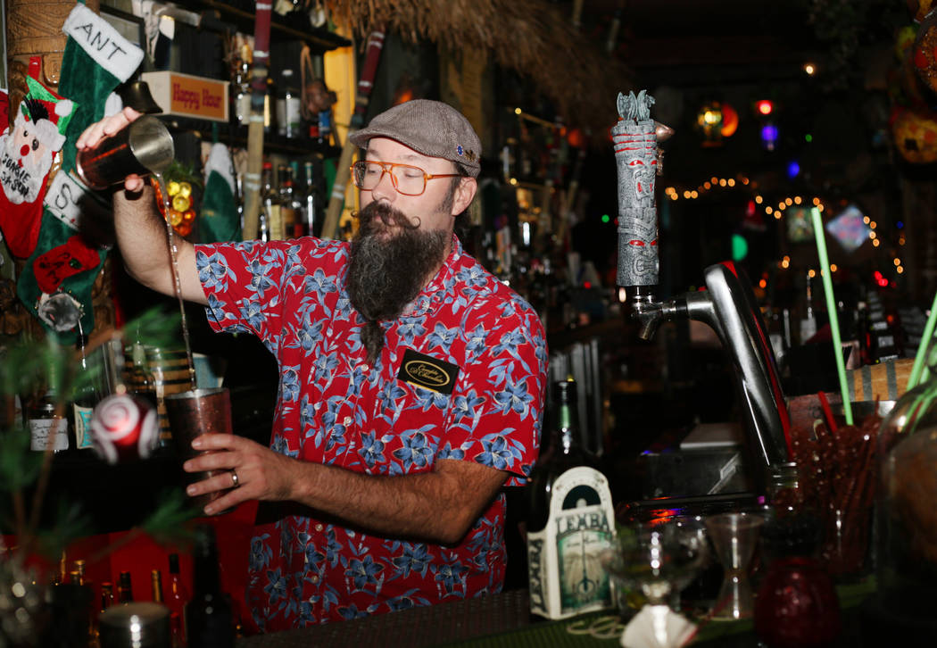 Lead bartender Adam Rains constructs a Baby Yoda cocktail at The Golden Tiki in Las Vegas on Mo ...