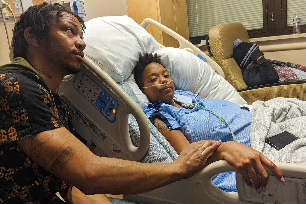 Johnathan Wilson comforts his wife, DeJoy Wilson, on Monday, Dec. 23, 2019, at Sunrise Hospital ...