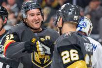 Vegas Golden Knights right wing Mark Stone (61, left) celebrates a goal with Vegas Golden Knigh ...