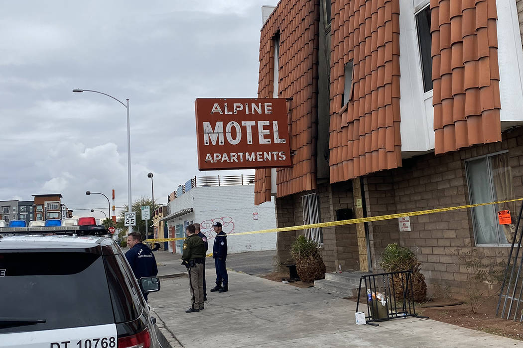 Metropolitan Police officers stand in front of the Alpine Motel apartments in Las Vegas on Tues ...