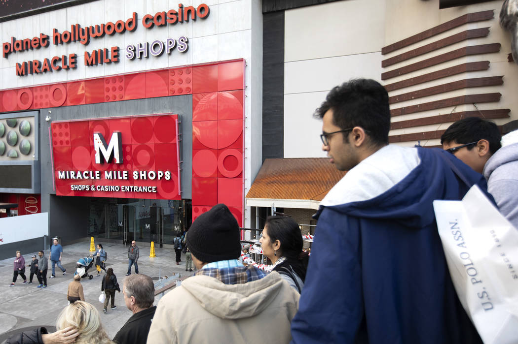 Holiday shoppers walk through Miracle Mile Shops on Tuesday, Dec. 24, 2019, in Las Vegas. The m ...