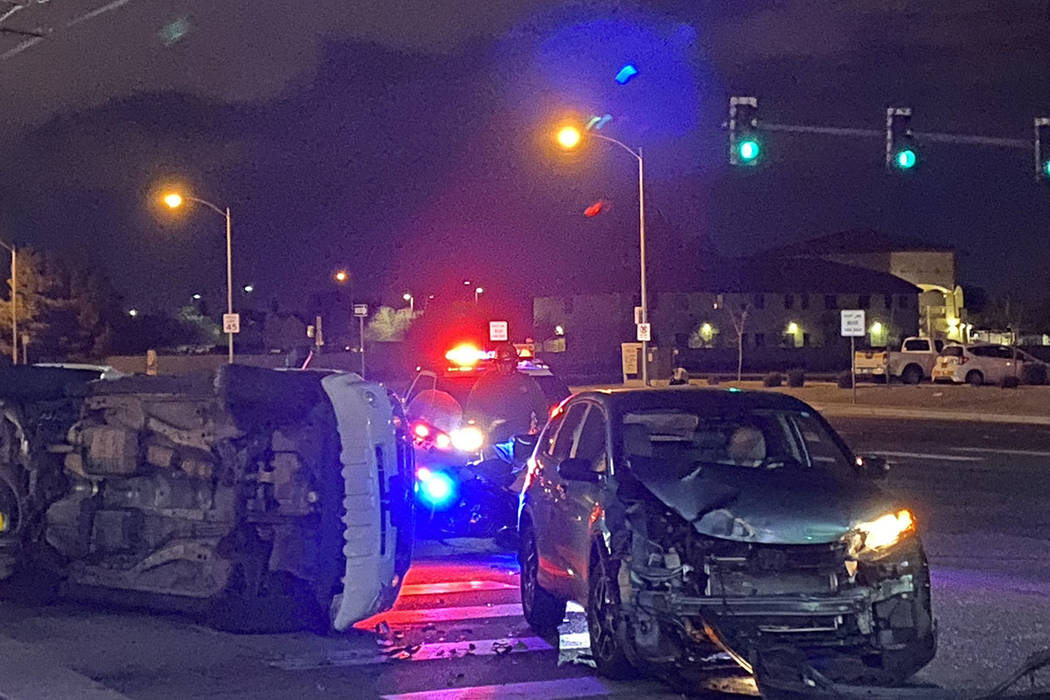 Police investigate a crash Tuesday, Dec. 24, 2019, at East Lake Mead Boulevard and North Walnut ...