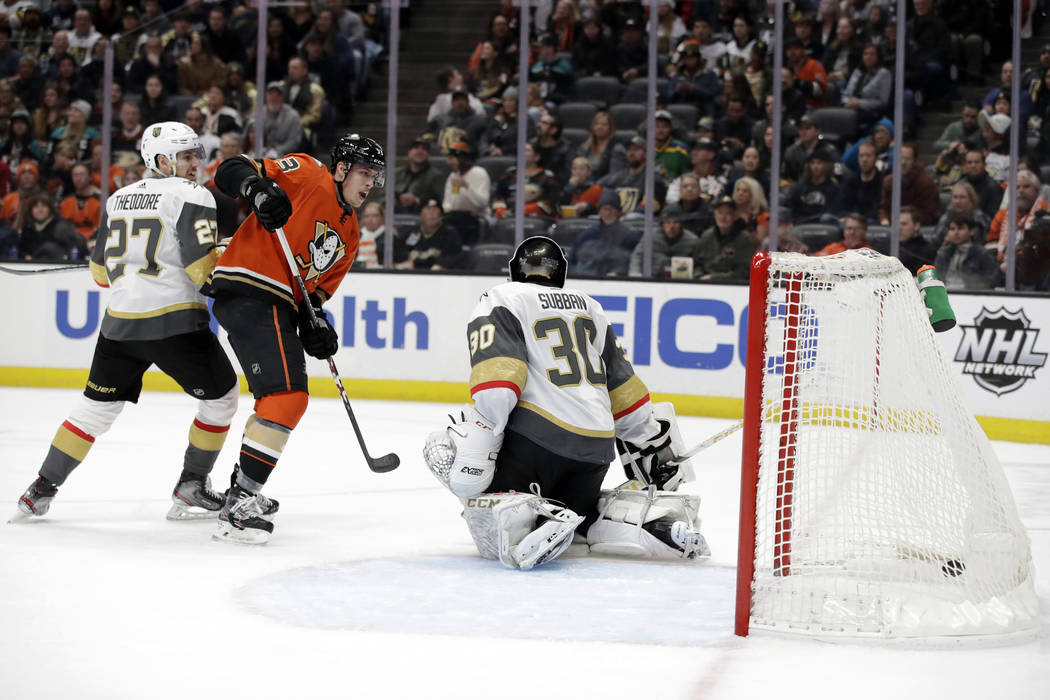 Anaheim Ducks' Max Comtois, second from left, scores past Vegas Golden Knights goaltender Malco ...