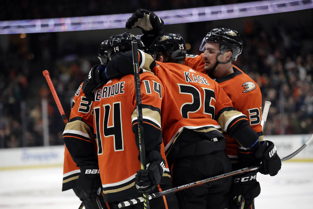 Anaheim Ducks' Adam Henrique (14) celebrates his goal with teammates during the second period o ...