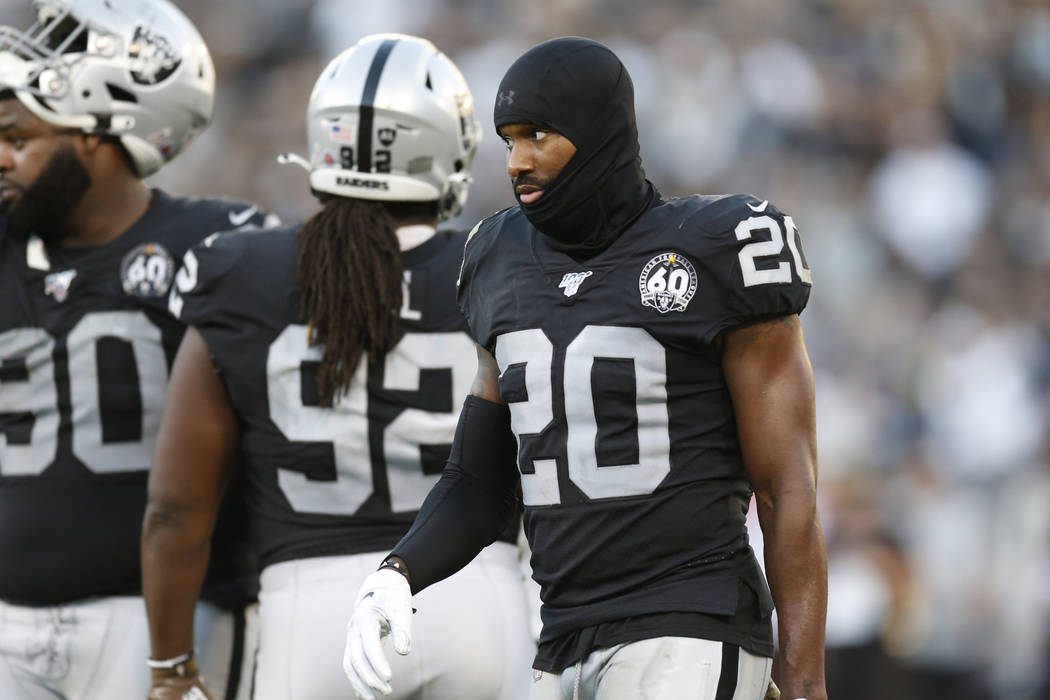 Oakland Raiders cornerback Daryl Worley (20), defensive tackle P.J. Hall (92), and defensive ta ...