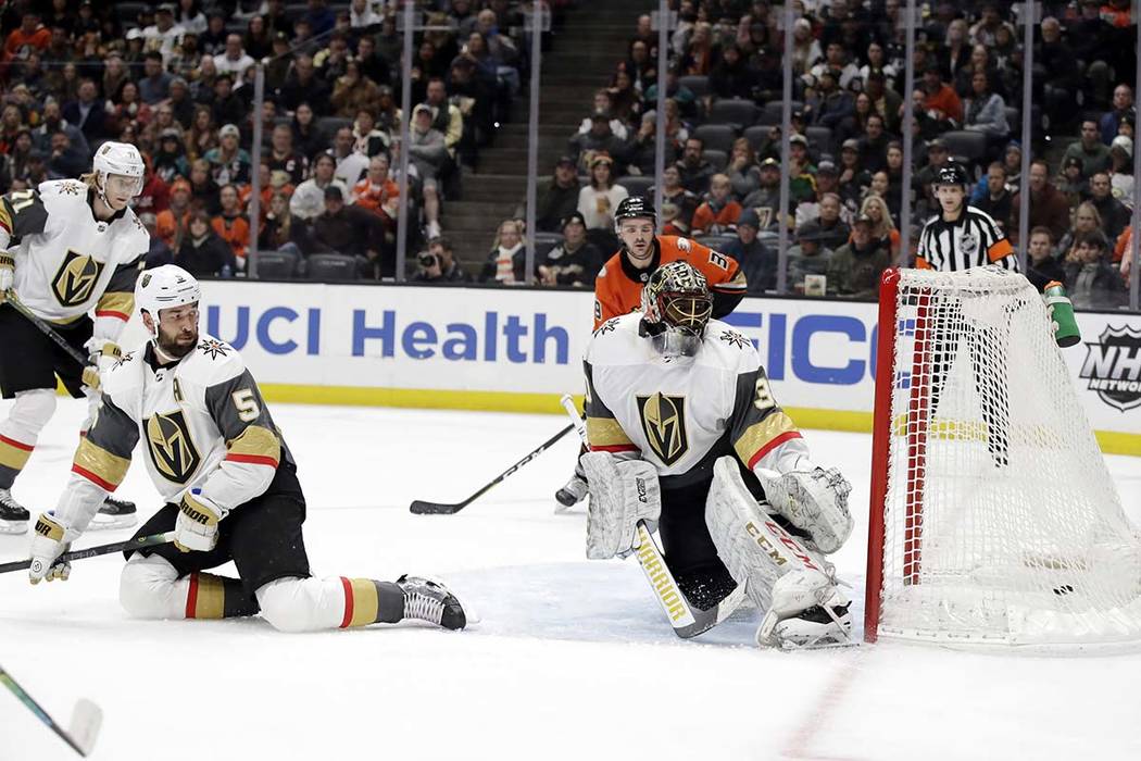 Vegas Golden Knights goaltender Malcolm Subban, right, gives up a goal on a shot from Anaheim D ...