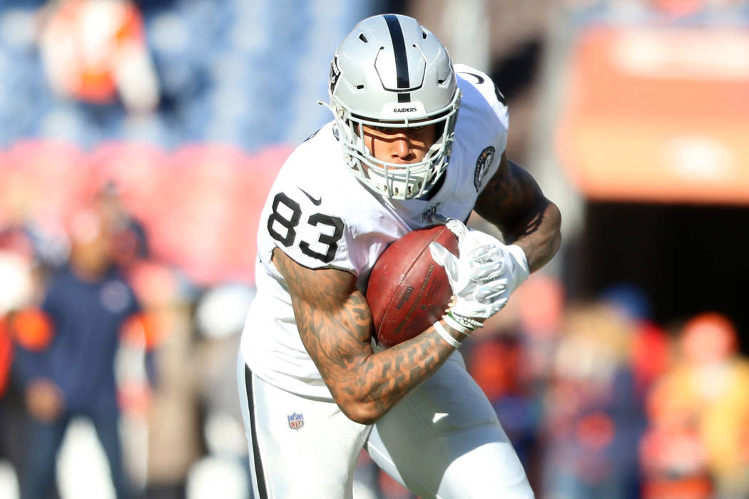 Oakland Raiders tight end Darren Waller (83) catches a ball before an NFL game against the Denv ...