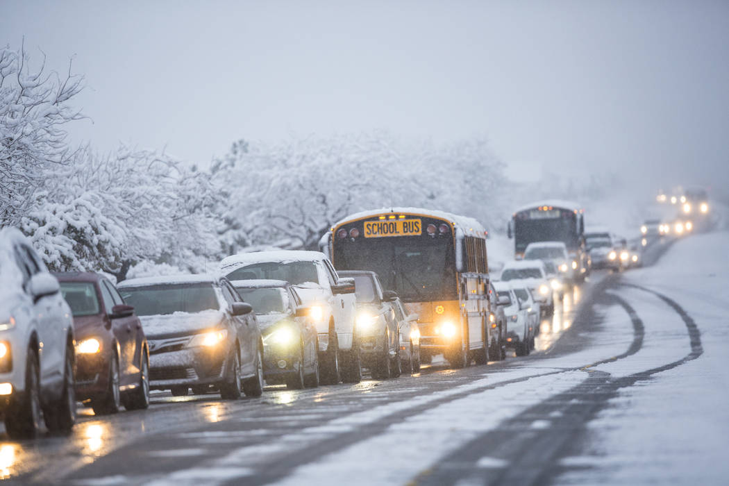 Traffic is backed up in heavy snow near Centennial High School on Thursday, Feb. 21, 2019, in L ...
