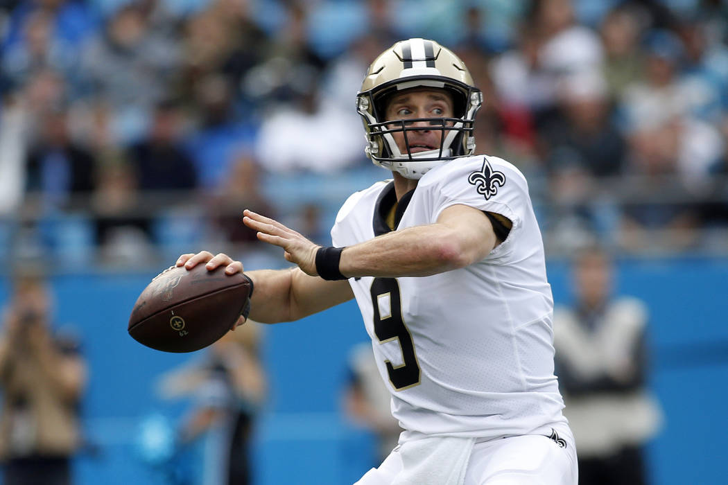 New Orleans Saints quarterback Drew Brees (9) passes against the Carolina Panthers during the f ...