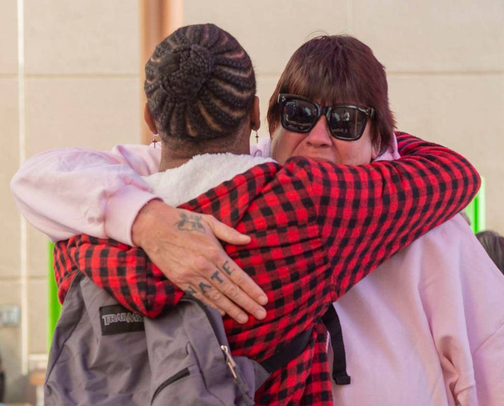 Alpine Motel residents Timothy Henry, left, and a tearful Sandra Jones, comfort one another dur ...