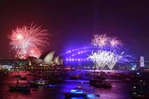 Fireworks are seen from Mrs. Macquarie's Chair during New Year's Eve celebrations in Sydney, Tu ...