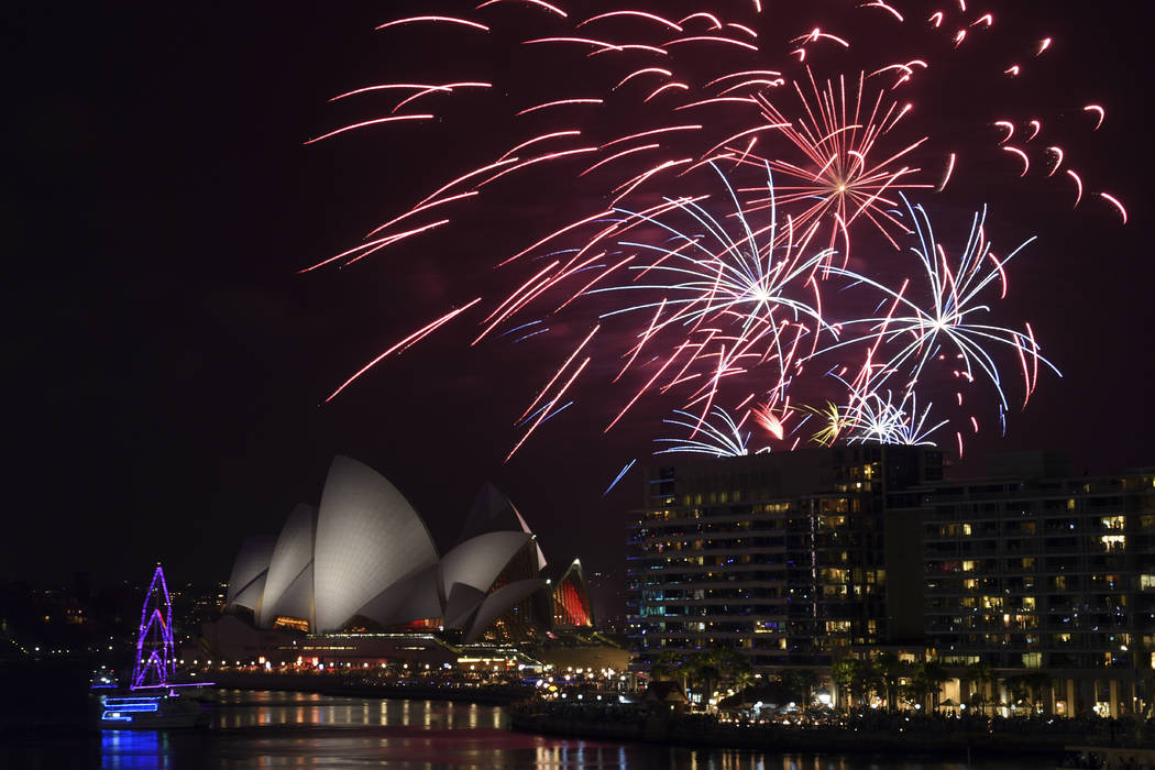 The 9pm family fireworks explode over the Sydney Opera House and Sydney Harbour Bridge on Sydne ...