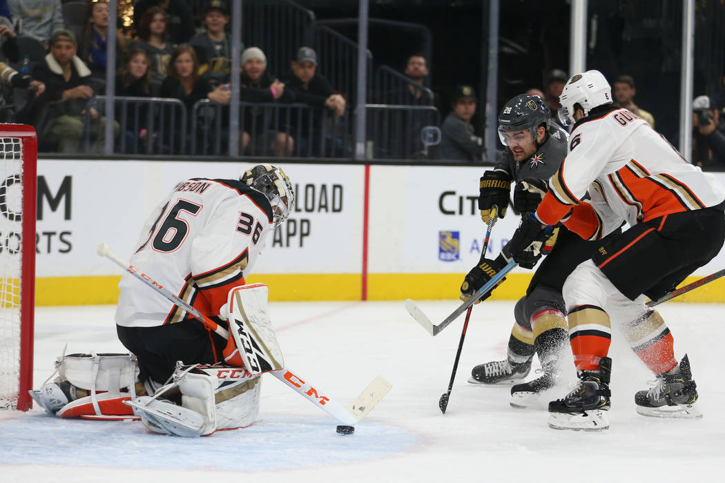 Vegas Golden Knights left wing William Carrier (28) battles for the puck against Anaheim Ducks ...