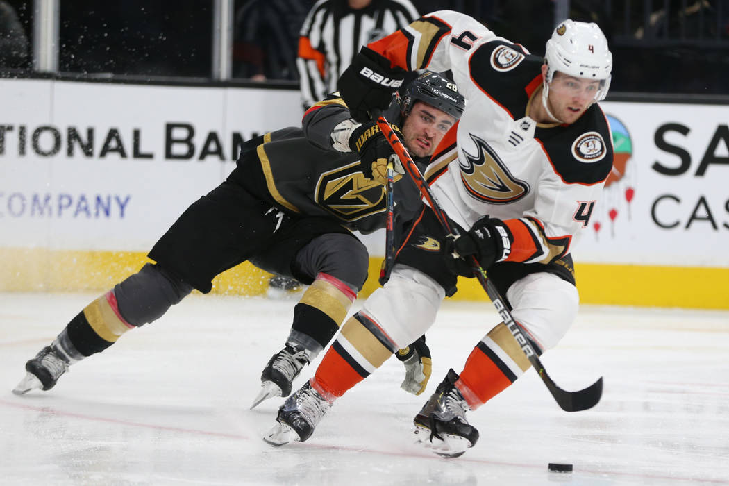 Vegas Golden Knights left wing William Carrier (28) chases Anaheim Ducks defenseman Cam Fowler ...