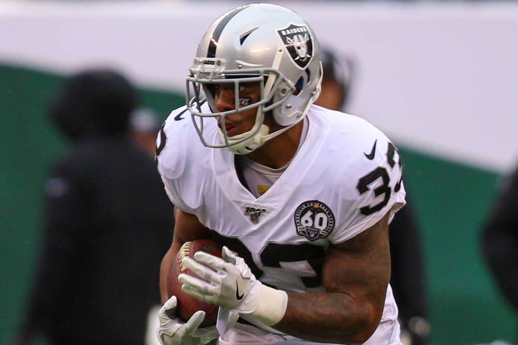 Oakland Raiders running back DeAndre Washington (33) runs with the football during the first ha ...