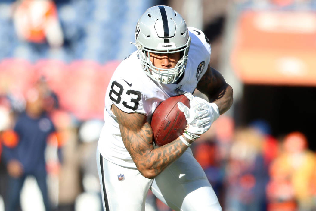 Oakland Raiders tight end Darren Waller (83) catches a ball before an NFL game against the Denv ...