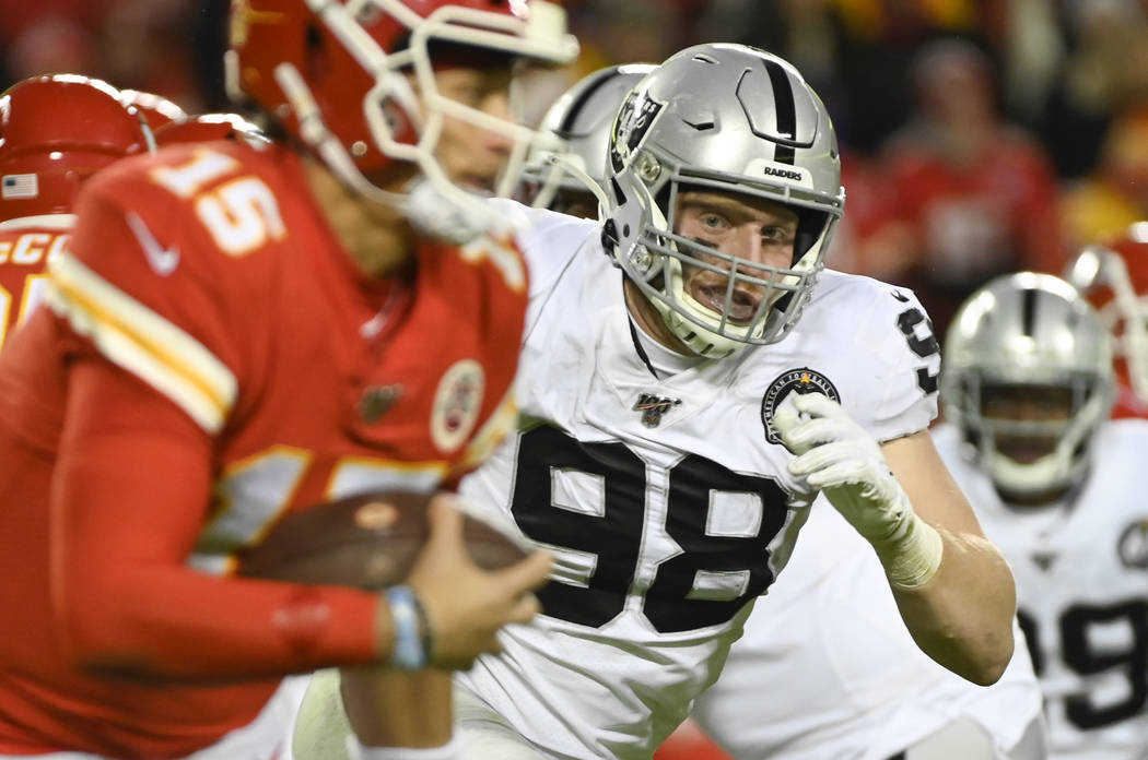 Oakland Raiders defensive end Maxx Crosby (98) chases Kansas City Chiefs quarterback Patrick Ma ...