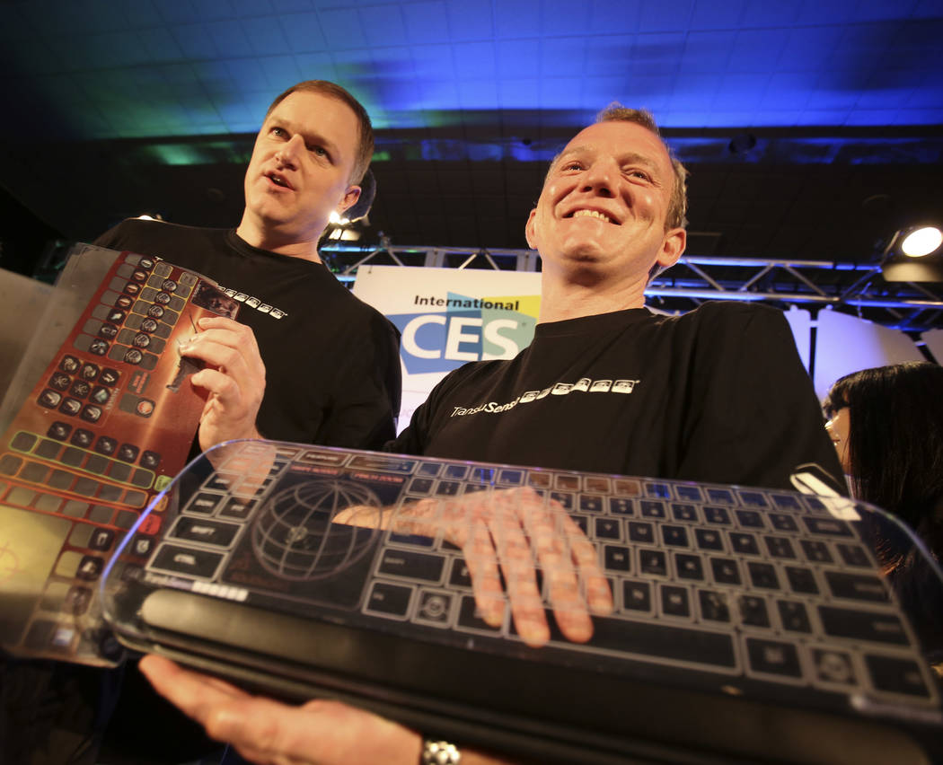 TransluSense executives Jason Giddings, left, and Mark Collins display the Luminae Cleartouch g ...