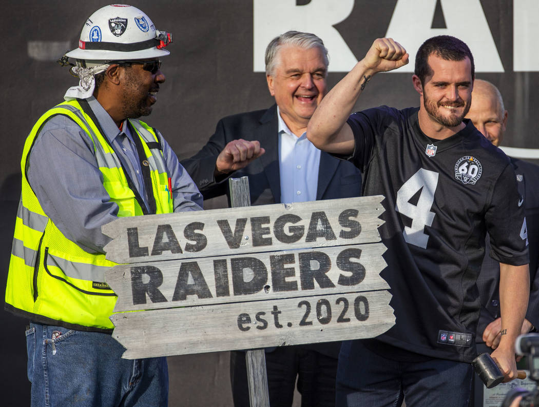 Las Vegas Raiders quarterback Derek Carr (4) pumps a fist to the crowd after hammering a ceremo ...