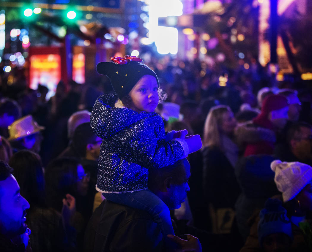 Sage Lewis, 3, from Las Vegas, watches performers on the Strip on Tuesday, Dec. 31, 2019, in La ...