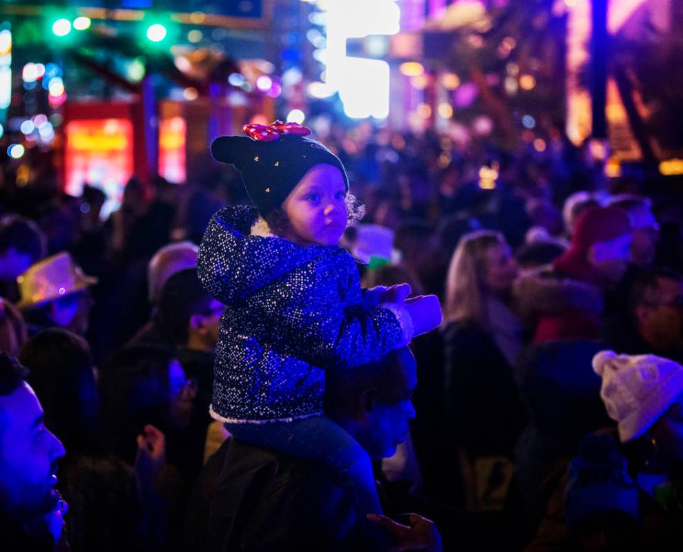 Sage Lewis, 3, from Las Vegas, watches performers on the Strip on Tuesday, Dec. 31, 2019, in La ...