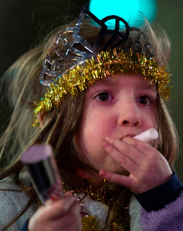 A girl blows a New Year's Eve kazoo on the Strip on Wednesday, Jan. 1, 2020, in Las Vegas. (Ell ...