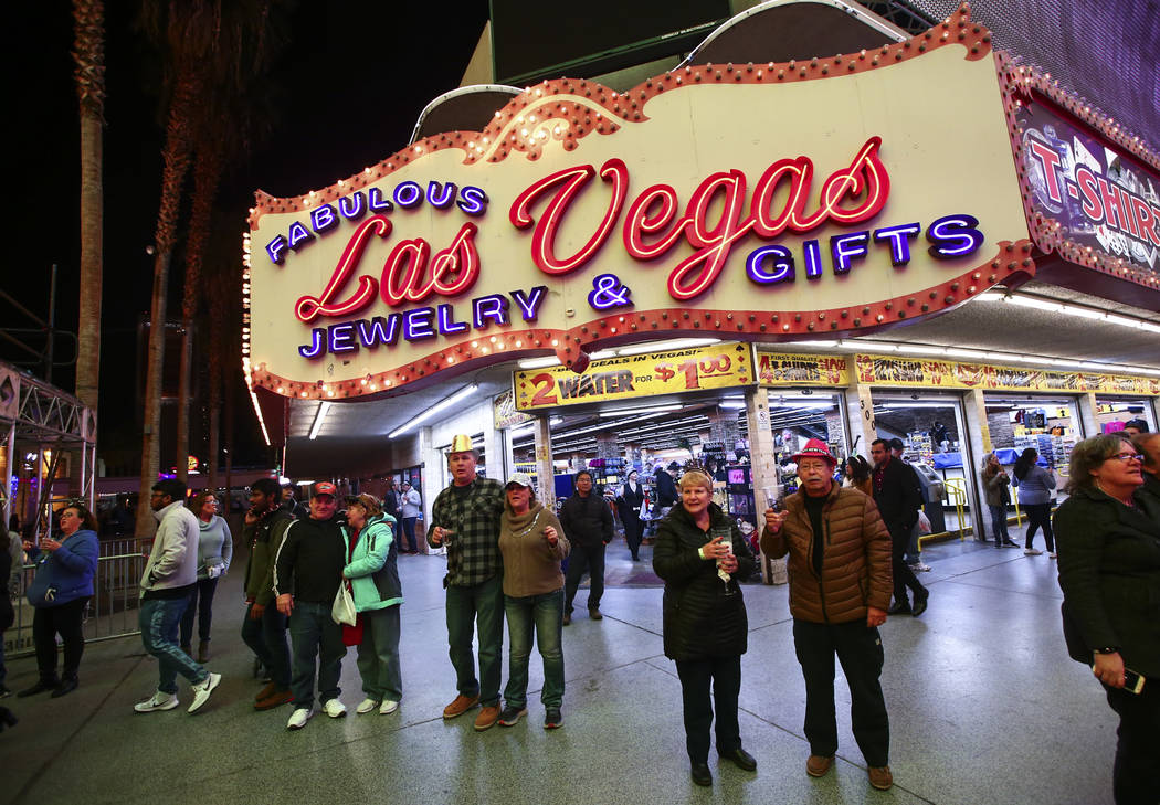 New Year's Eve revelers gather at the Fremont Street Experience in downtown Las Vegas on Tuesda ...