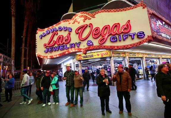 New Year's Eve revelers gather at the Fremont Street Experience in downtown Las Vegas on Tuesda ...