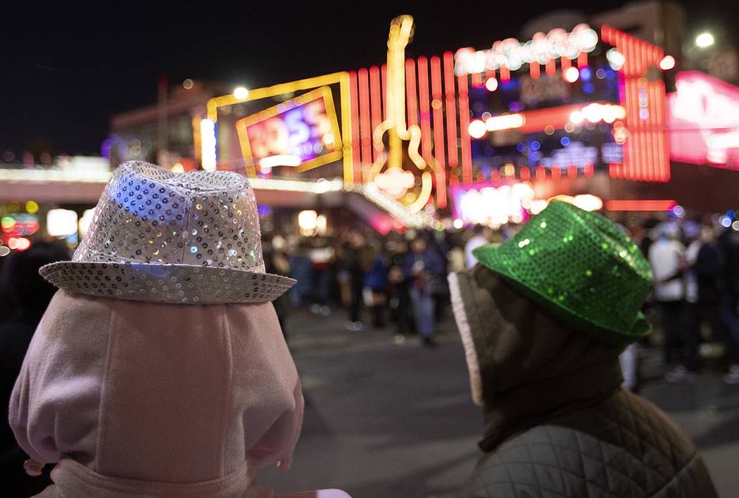 Some were bundled up to see the fireworks on the Las Vegas Strip on Tuesday, Dec. 31, 2019, in ...