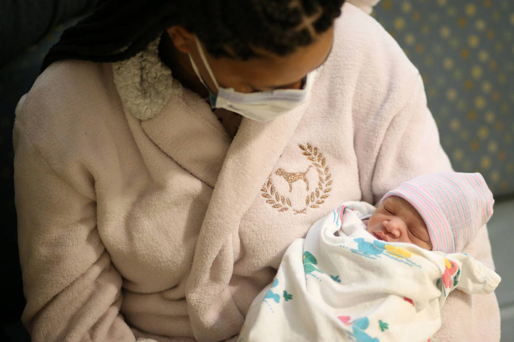 Latasha Atkinson with their newborn baby Marquis Johnson Jr. at Sunrise Children's Hospital in ...