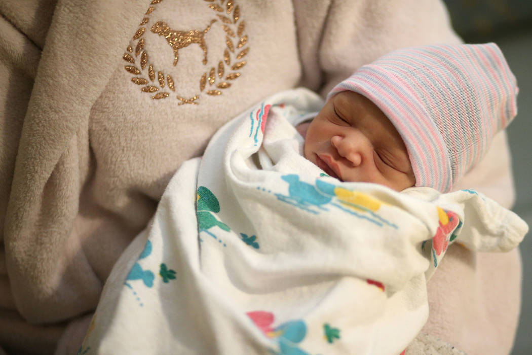 Marquis Johnson Jr. was born 37 seconds after midnight to be the first baby of the year at Sunr ...