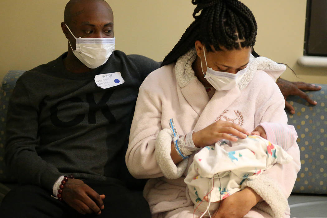 Marquis Johnson Sr. and Latasha Atkinson with their newborn baby Marquis Jr. at Sunrise Childre ...