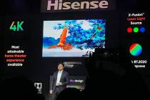 Industry insiders listen to a media event by Hisense ahead of CES 2020 on Monday, Jan. 6, 2020 ...