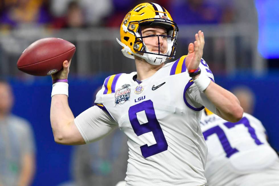 LSU quarterback Joe Burrow (9) works against Oklahoma during the first half of the Peach Bowl N ...