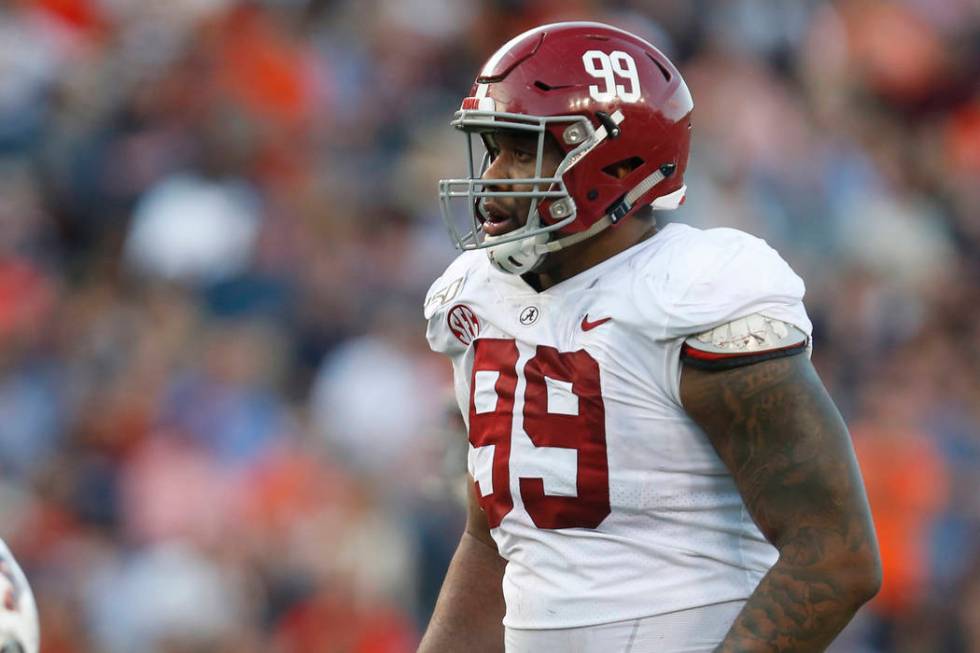 Alabama defensive lineman Raekwon Davis (99) lines up for a play against Auburn during an NCAA ...