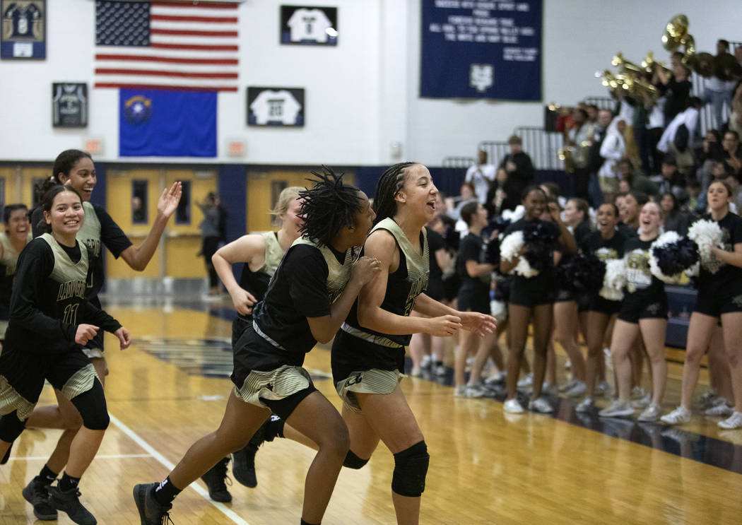 Spring Valley girls basketball runs to the locker room before halftime right after scoring a th ...