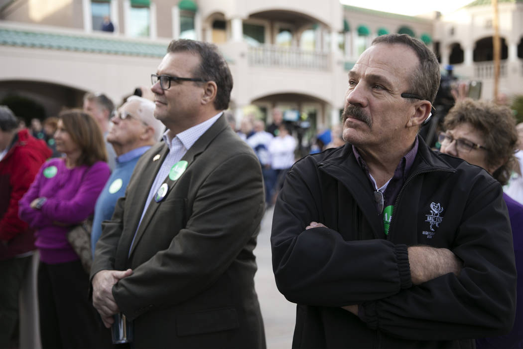 Supporter Chris Lloyd listens to Democratic presidential candidate Amy Klobuchar speak during a ...