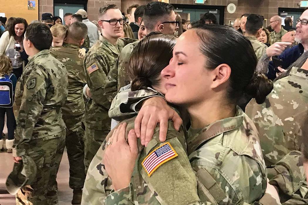 Sgt. 1st Class Luciana Irenze (right) hugs Sgt. Alison Martindale following the mobilization ce ...
