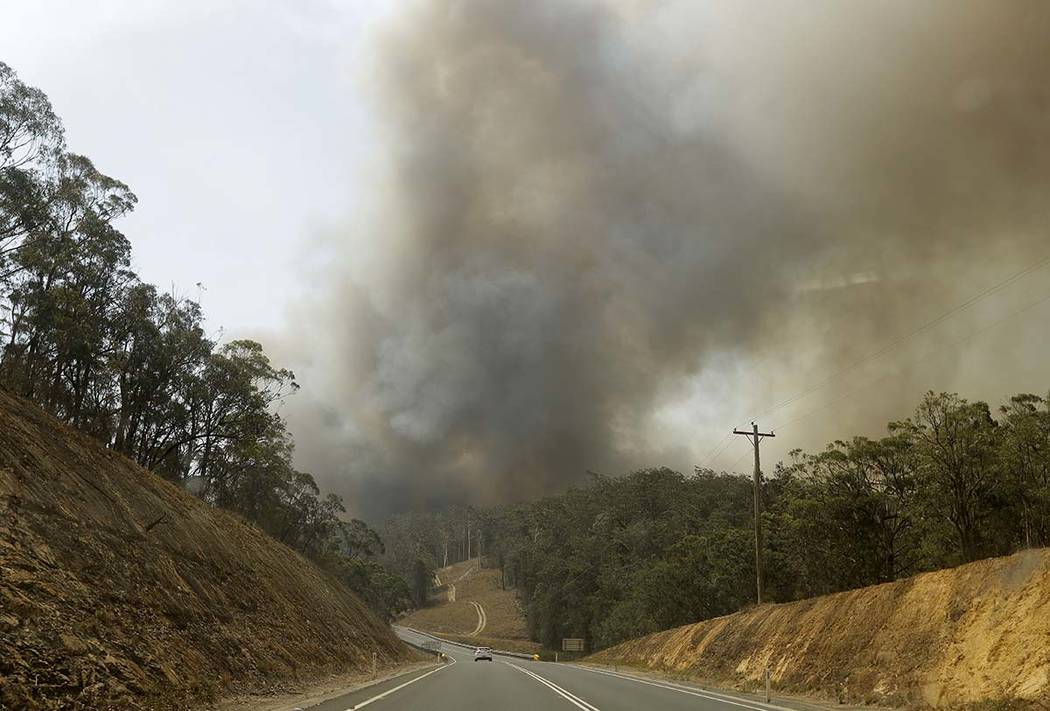 Smoke from a fire at Batemans Bay, Australia, billows into the air, Saturday, Jan. 4, 2020. Aus ...