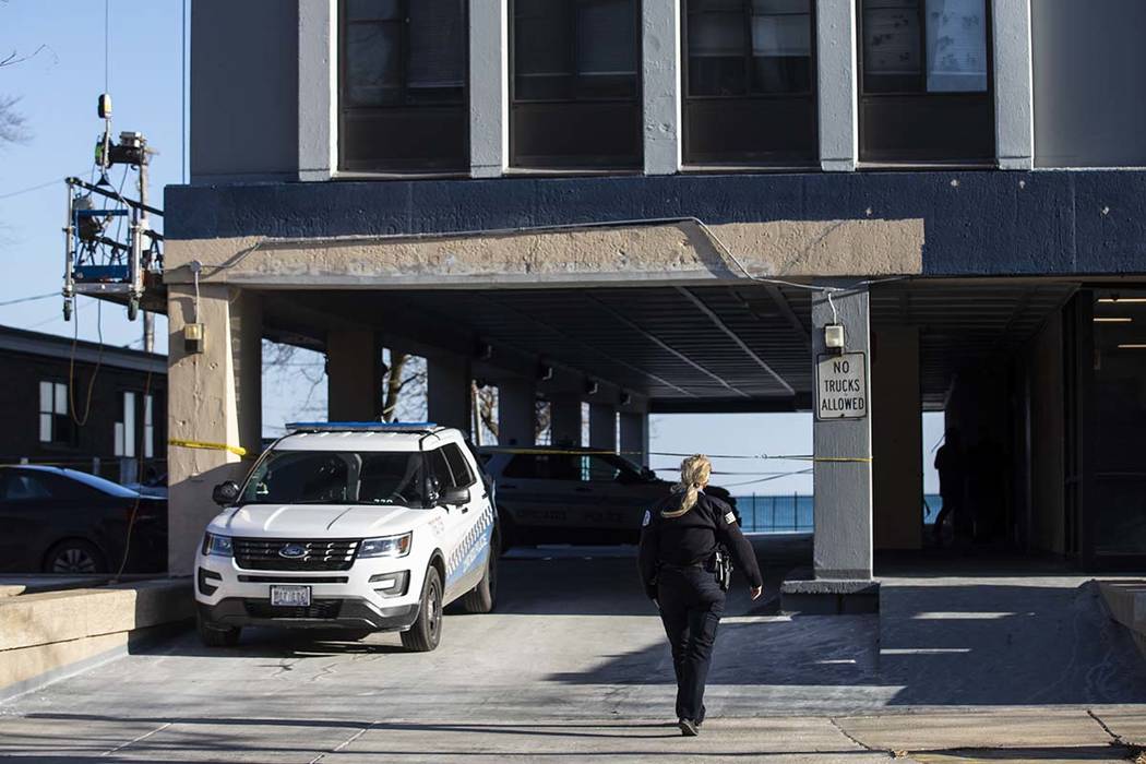 Chicago Police investigate at a South Shore neighborhood high-rise apartment building in the 72 ...