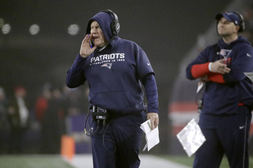 New England Patriots head coach Bill Belichick gives instructions to the team from the sideline ...