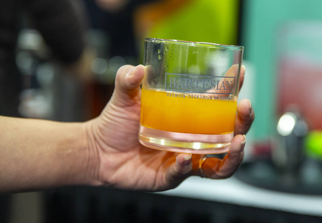 A whisky drink made fresh from the Bartesian premium cocktails on demand machine during the &qu ...